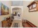 Inviting hallway with neutral walls, tiled floors, and decorative furnishings creates a warm and welcoming entrance at 2839 Drifting Lilly Loop, Kissimmee, FL 34747