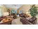 Cozy living room with comfortable seating, a large TV, and stylish decor, ideal for relaxation at 2839 Drifting Lilly Loop, Kissimmee, FL 34747