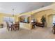 Open-concept living space featuring dining area and comfortable seating, perfect for entertaining at 2839 Drifting Lilly Loop, Kissimmee, FL 34747