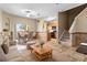 Open living room flowing into dining area and kitchen, highlighted by tile floors and a staircase at 2850 Retreat View Cir, Sanford, FL 32771