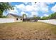 The large backyard features an in-ground pool area surrounded by a white vinyl fence at 2910 S Whisperbay Ct, Oviedo, FL 32765