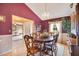 Elegant dining room with wood table, chandelier, and views into the adjacent living area at 2910 S Whisperbay Ct, Oviedo, FL 32765