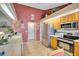 Well-lit kitchen featuring modern stainless steel appliances, and view of the breakfast table with chairs at 2910 S Whisperbay Ct, Oviedo, FL 32765