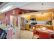 Well-lit kitchen featuring modern stainless steel appliances, and breakfast table with chairs at 2910 S Whisperbay Ct, Oviedo, FL 32765