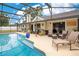 The pool sits just outside the home with ample seating and lounging options available at 2910 S Whisperbay Ct, Oviedo, FL 32765