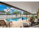 Enclosed pool area features comfortable seating, a pool, and a spa, great for entertaining at 2910 S Whisperbay Ct, Oviedo, FL 32765