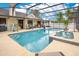 The pool features a jacuzzi and covered area with seating for entertaining and relaxation at 2910 S Whisperbay Ct, Oviedo, FL 32765