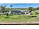 Gorgeous home with a screened-in pool surrounded by lush landscaping, offering a private and tranquil outdoor space at 29150 Beauclaire Dr, Tavares, FL 32778