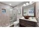 Elegant bathroom featuring a glass-enclosed shower, modern vanity with a vessel sink, and stylish fixtures at 29150 Beauclaire Dr, Tavares, FL 32778