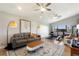 Versatile bonus room includes seating, a workout area, and a window view at 29150 Beauclaire Dr, Tavares, FL 32778