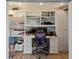 Well-organized home office with custom shelving, desk space, and ample storage for a productive workspace at 29150 Beauclaire Dr, Tavares, FL 32778
