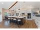 Spacious kitchen with large island, stainless steel appliances, breakfast bar, and views to dining room at 29150 Beauclaire Dr, Tavares, FL 32778