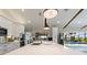 Contemporary kitchen with large island, stainless appliances, and a clear view to the backyard pool area at 29150 Beauclaire Dr, Tavares, FL 32778