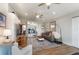 Bright living room featuring wood-look floors, a large rug, and a mirrored wall for added spaciousness at 29150 Beauclaire Dr, Tavares, FL 32778