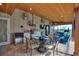 Outdoor kitchen, dining, and seating area with a lovely view at 29150 Beauclaire Dr, Tavares, FL 32778