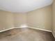 Bedroom featuring neutral color walls, carpet, and base molding at 30411 Gidran Ter, Mount Dora, FL 32757