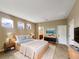 Serene bedroom featuring a comfortable bed, modern decor, and ample natural light at 30411 Gidran Ter, Mount Dora, FL 32757