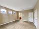 Spacious bedroom featuring neutral walls, carpet, and lots of natural light from three windows at 30411 Gidran Ter, Mount Dora, FL 32757