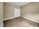 Bedroom featuring neutral color walls, carpet, and closet with double doors at 30411 Gidran Ter, Mount Dora, FL 32757
