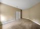 Bedroom featuring neutral color walls, carpet, and closet with double doors at 30411 Gidran Ter, Mount Dora, FL 32757