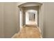 Neutral hallway featuring arches and tile floors at 30411 Gidran Ter, Mount Dora, FL 32757