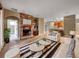 Inviting living room with fireplace, stylish furniture, and an open floor plan at 30411 Gidran Ter, Mount Dora, FL 32757
