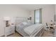 Bright bedroom with a large window, desk, and stylish decor, with neutral color scheme at 31 Abacus Ave, Ormond Beach, FL 32174
