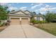 Charming home featuring a three-car garage and well-maintained landscaping at 31 Abacus Ave, Ormond Beach, FL 32174