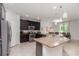 Modern kitchen with stainless steel appliances, granite countertops, and large island at 31 Abacus Ave, Ormond Beach, FL 32174
