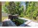Backyard koi pond with stone accents and lush greenery, adding a touch of nature at 31 Abacus Ave, Ormond Beach, FL 32174