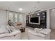 Elegant living room with recessed lighting and a large entertainment center at 31 Abacus Ave, Ormond Beach, FL 32174