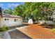 Spacious backyard featuring a storage shed and a quaint, white privacy fence, perfect for outdoor activities at 4366 Roanne Dr, Orlando, FL 32817