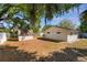 Backyard featuring a shed and white privacy fence, perfect for outdoor activities at 4366 Roanne Dr, Orlando, FL 32817
