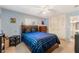Spacious bedroom with a large bed, neutral carpet, walk-in closet, and lots of natural light at 4366 Roanne Dr, Orlando, FL 32817