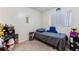 Simple bedroom featuring neutral carpet, twin bed, and a bright window at 4366 Roanne Dr, Orlando, FL 32817