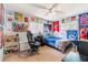 Bright bedroom with themed decor, neutral carpet, and a ceiling fan at 4366 Roanne Dr, Orlando, FL 32817