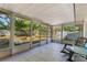 Sunroom with multiple windows, tile floors, and a view of the backyard at 4366 Roanne Dr, Orlando, FL 32817