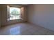 Bright bedroom with tile floors and a shuttered window overlooking the front yard at 458 Cadenza Dr, Orlando, FL 32807