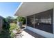 An enclosed, screened-in patio with access to the backyard, offers an airy space for relaxation and entertaining at 458 Cadenza Dr, Orlando, FL 32807