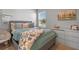 Relaxing bedroom featuring soft blue tones, a comfortable bed, and stylish decor for a serene atmosphere at 4630 Cragmere Loop, Clermont, FL 34711