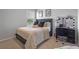 Cozy bedroom featuring a comfortable bed, stylish decor, and a vanity for added convenience at 4630 Cragmere Loop, Clermont, FL 34711