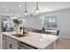 Spacious kitchen island overlooking the dining and living areas for open-concept living at 4630 Cragmere Loop, Clermont, FL 34711