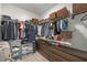 Organized walk-in closet featuring ample storage space with shelving, hanging racks, and drawers at 4630 Cragmere Loop, Clermont, FL 34711