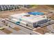 Aerial view of a modern elementary school with parking and bus lanes in a community at 4994 Citrus Leaf Blvd, Winter Garden, FL 34787