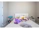 Cozy bedroom featuring soft carpet, a bed and a fun collection of decorative pillows at 4994 Citrus Leaf Blvd, Winter Garden, FL 34787