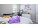 Bright bedroom with a window, a desk, keyboard and drawer unit with decor at 4994 Citrus Leaf Blvd, Winter Garden, FL 34787