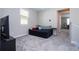 This comfortable loft space features soft carpet and neutral colored walls with a window that offers natural light at 4994 Citrus Leaf Blvd, Winter Garden, FL 34787