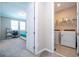 Bedroom view shows a closet and laundry area with a modern washer and dryer at 4994 Citrus Leaf Blvd, Winter Garden, FL 34787