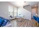 Cozy dining area features modern decor, with sleek furnishings, ample natural light, and convenient access to the staircase at 4994 Citrus Leaf Blvd, Winter Garden, FL 34787