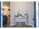 Inviting entryway featuring stylish console table and view of the staircase and living space at 4994 Citrus Leaf Blvd, Winter Garden, FL 34787